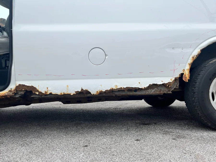 Cargo van rocker panel rusted through along its full length