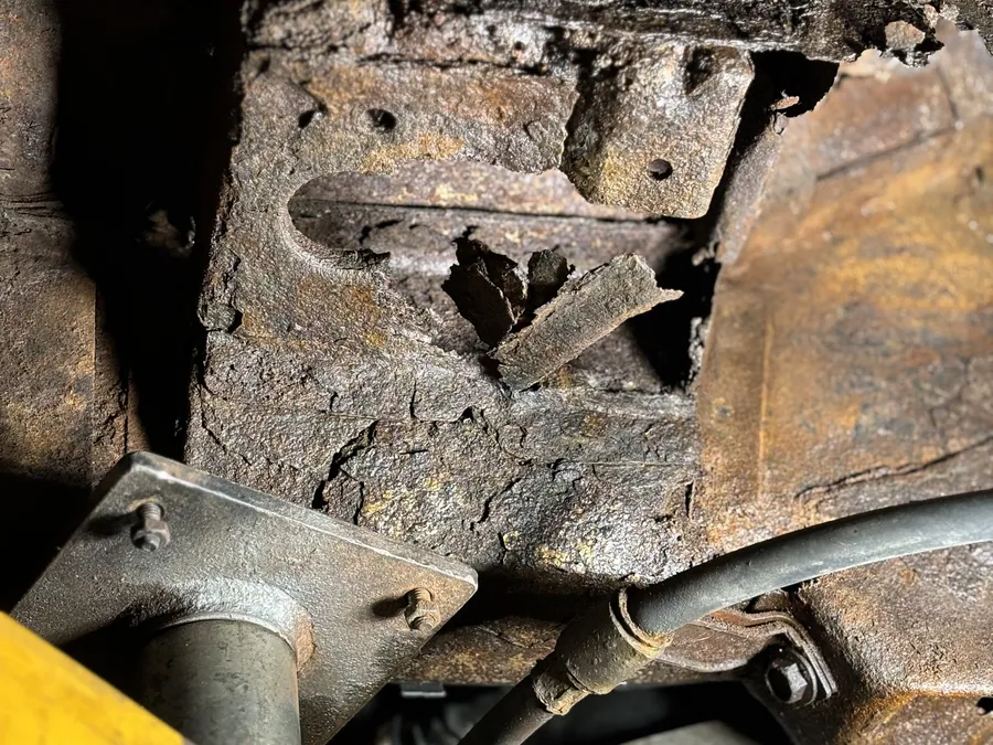 Trailing arm mount rusted completely through on a truck underbody