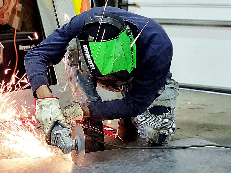 Grinding a finished repair at a Cleveland auto repair shop