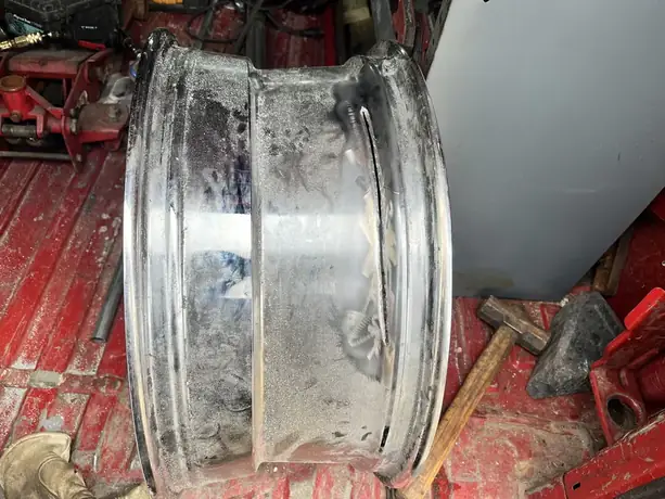 Cracked alloy rim being repaired