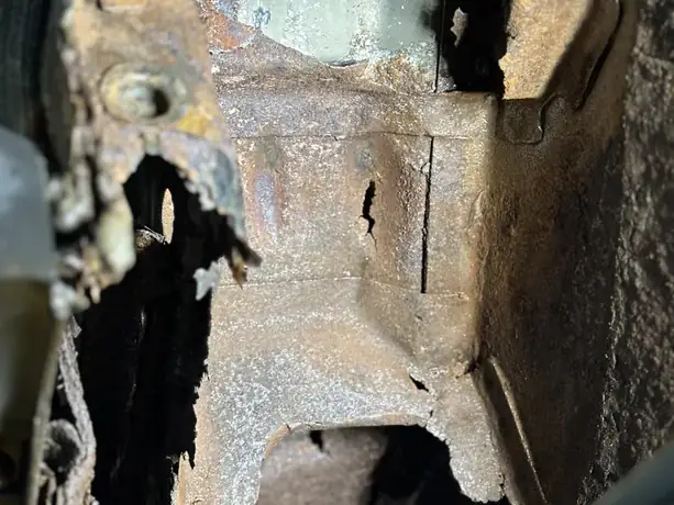 Trailing arm mount rusted through before repair
